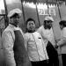 Young cooks in front of restaurant where they work in Datong