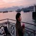 A young boy is contemplated a sunset scenery after having fished in Hong Kong Cheung chau island harbor